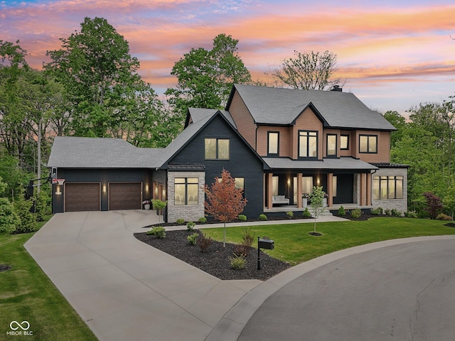 11064 Hamilton Run, Zionsville, IN 46077 - view of front of property with an attached garage, driveway, a porch, a front lawn, and stone siding