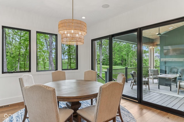 11064 Hamilton Run, Zionsville, IN 46077 - dining space featuring hardwood / wood-style flooring, a chandelier, baseboards, and recessed lighting