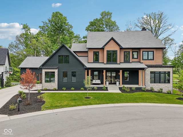 11064 Hamilton Run, Zionsville, IN 46077 - view of front of house featuring stone siding, a front lawn, covered porch, and a chimney