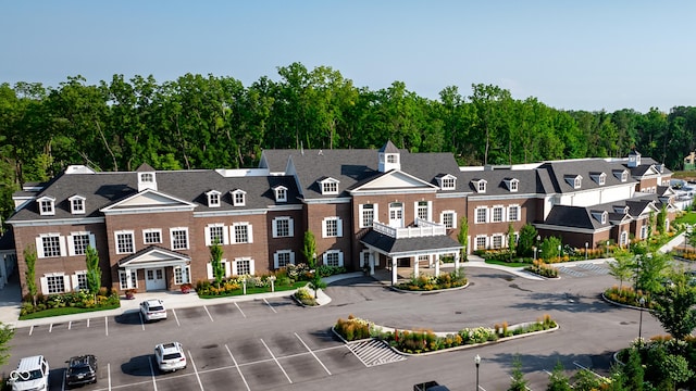 11064 Hamilton Run, Zionsville, IN 46077 - view of building exterior with uncovered parking and a residential view