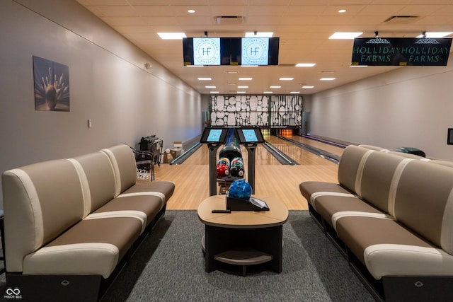 11064 Hamilton Run, Zionsville, IN 46077 - game room featuring a bowling alley, wood finished floors, a drop ceiling, and baseboards