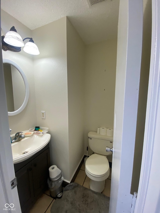 2350 Harvest Moon Dr, Greenwood, IN 46143 - bathroom featuring toilet, a textured ceiling, tile patterned flooring, and vanity