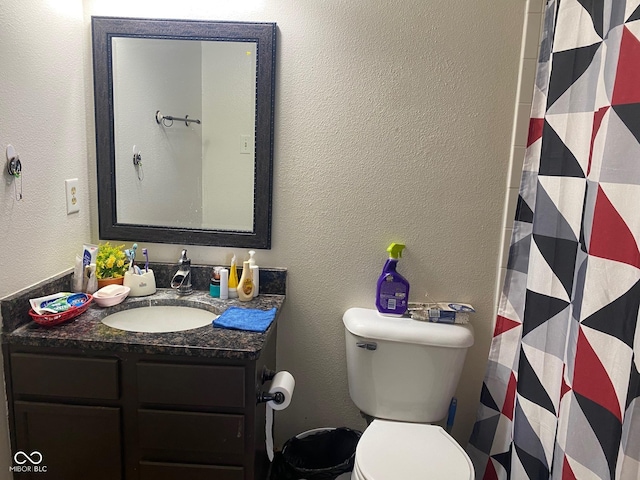 2350 Harvest Moon Dr, Greenwood, IN 46143 - bathroom featuring vanity, a textured wall, a shower with curtain, and toilet