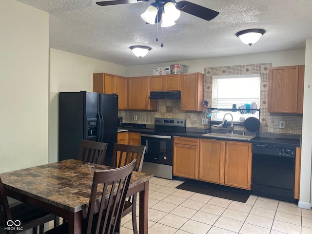 2350 Harvest Moon Dr, Greenwood, IN 46143 - kitchen featuring ceiling fan, under cabinet range hood, tasteful backsplash, a sink, and black appliances