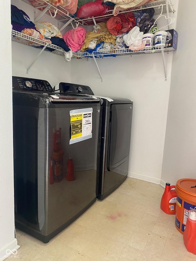 2350 Harvest Moon Dr, Greenwood, IN 46143 - laundry room featuring independent washer and dryer, laundry area, baseboards, and light floors