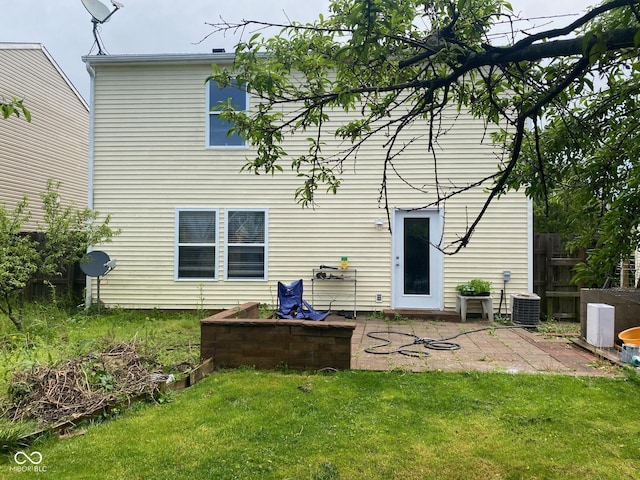 2350 Harvest Moon Dr, Greenwood, IN 46143 - rear view of house with fence, a patio, a yard, and cooling unit
