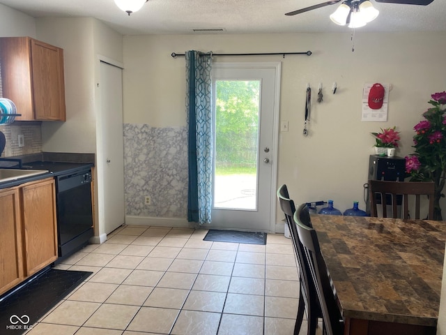 2350 Harvest Moon Dr, Greenwood, IN 46143 - kitchen featuring dark countertops, black dishwasher, brown cabinets, and visible vents