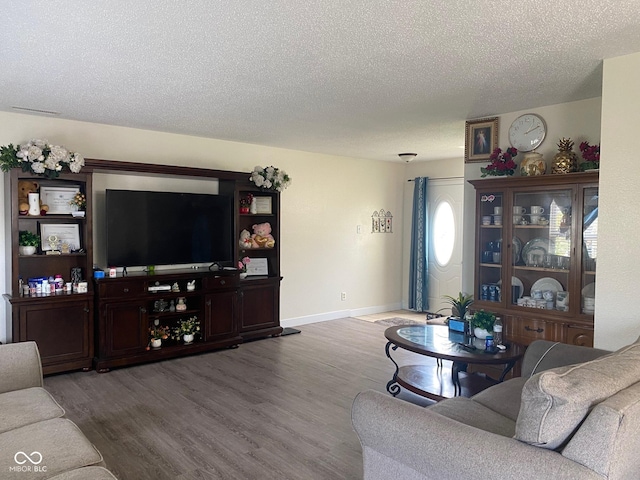 2350 Harvest Moon Dr, Greenwood, IN 46143 - living room with baseboards, a textured ceiling, and wood finished floors