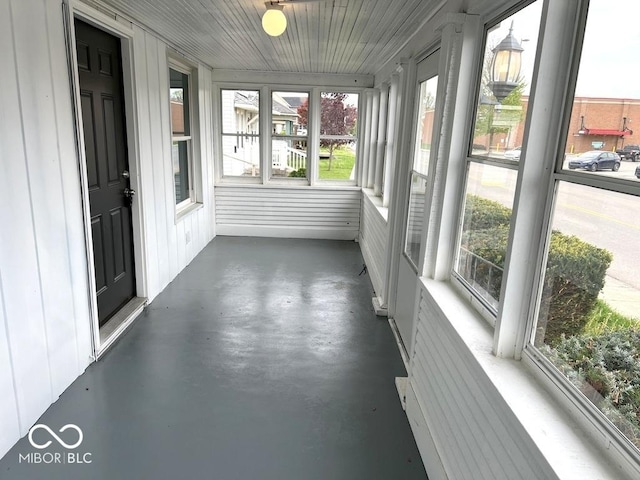 unfurnished sunroom featuring plenty of natural light