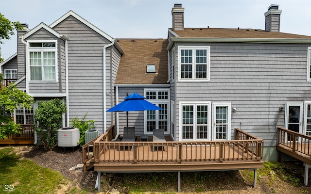 2823 Somerset Bay, Indianapolis, IN 46240 - back of property with a chimney, a deck, and roof with shingles
