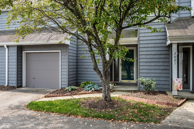 2823 Somerset Bay, Indianapolis, IN 46240 - doorway to property featuring asphalt driveway and a shingled roof