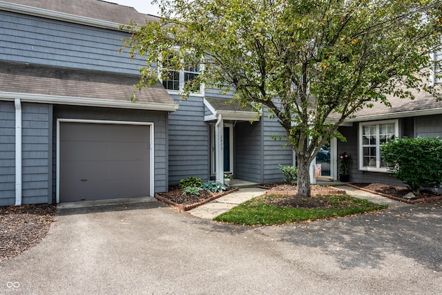 2823 Somerset Bay, Indianapolis, IN 46240 - view of front of home with driveway, roof with shingles, and a garage
