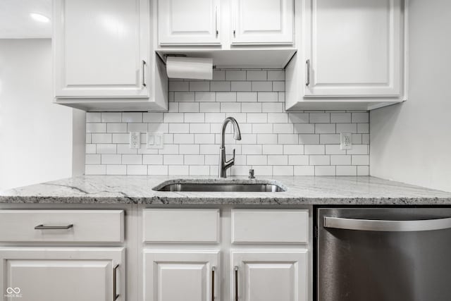 2823 Somerset Bay, Indianapolis, IN 46240 - kitchen featuring stainless steel dishwasher, white cabinets, tasteful backsplash, and light stone countertops