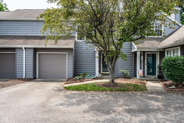 2823 Somerset Bay, Indianapolis, IN 46240 - townhome / multi-family property featuring asphalt driveway, roof with shingles, and a garage