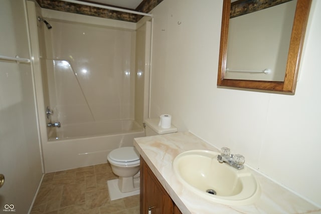 full bathroom with vanity, toilet, stone finish flooring, and bathtub / shower combination