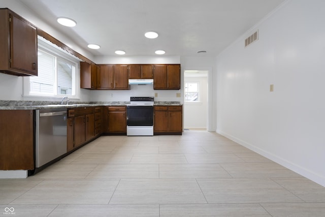 kitchen featuring visible vents, under cabinet range hood, electric stove, dishwasher, and a wealth of natural light
