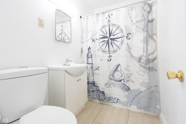 bathroom featuring vanity, curtained shower, toilet, and wood finished floors