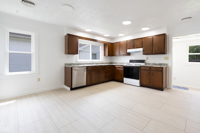 kitchen featuring visible vents, dishwasher, light countertops, electric stove, and under cabinet range hood