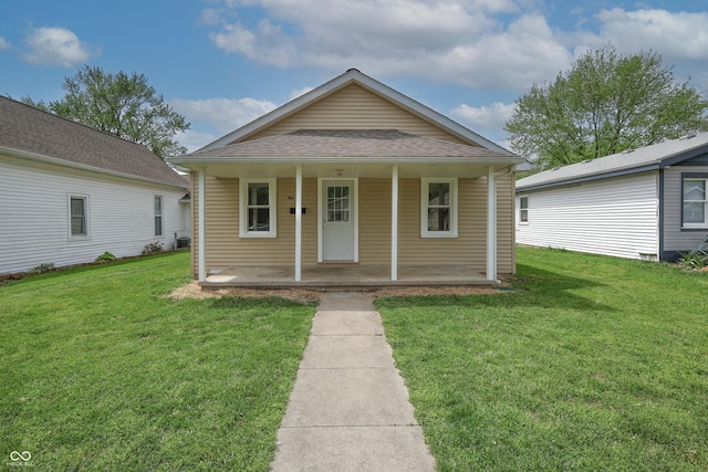 bungalow-style house featuring a porch and a front yard