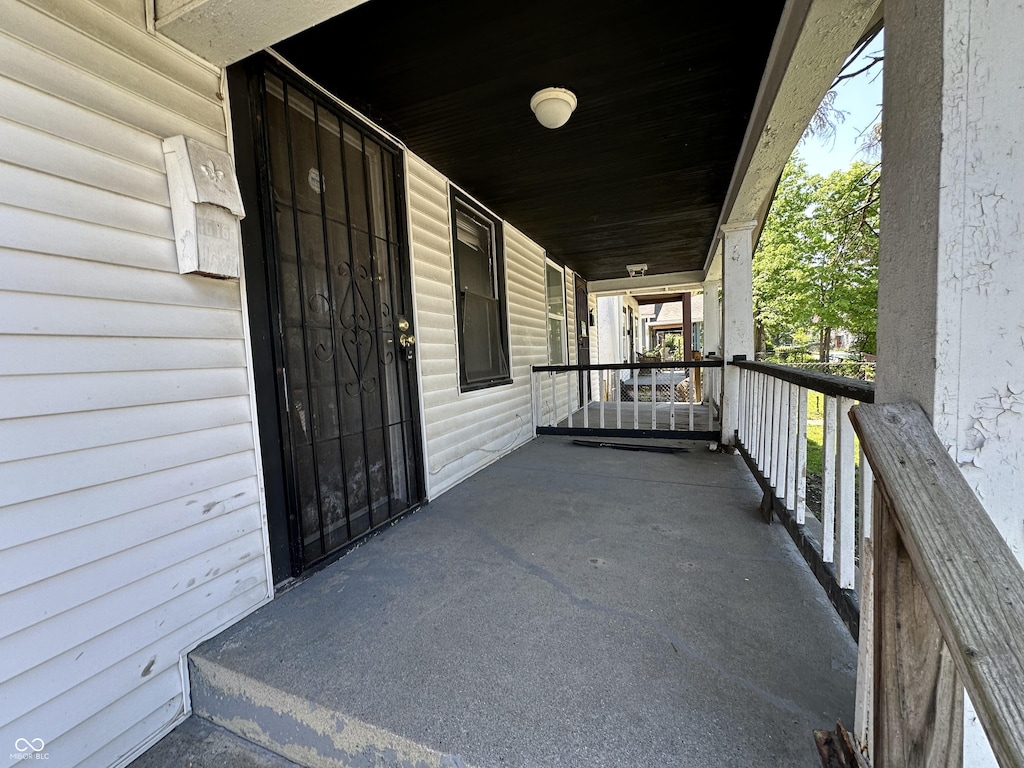 1513 N Kealing Ave, Indianapolis, IN 46201 - balcony featuring covered porch
