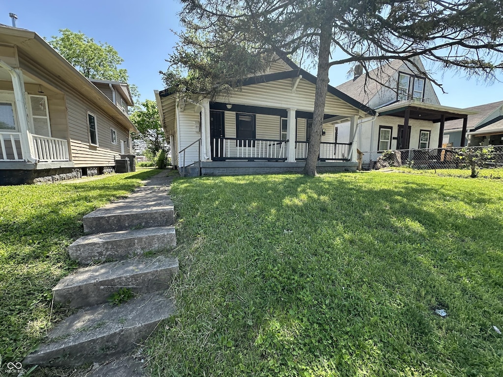 1513 N Kealing Ave, Indianapolis, IN 46201 - view of front of property featuring covered porch and central AC unit