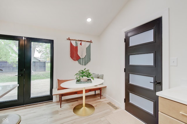 doorway to outside featuring french doors, lofted ceiling, recessed lighting, and baseboards