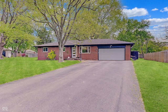 ranch-style house with a garage, asphalt driveway, and brick siding