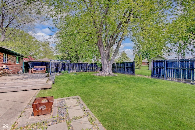 view of yard featuring a wooden deck
