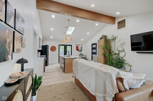 reception with a skylight, a sink, and recessed lighting