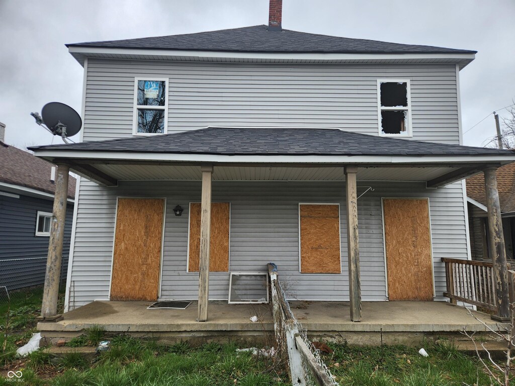 306-308 S Temple Ave, Indianapolis, IN 46201 - back of house with a porch, roof with shingles, and a chimney