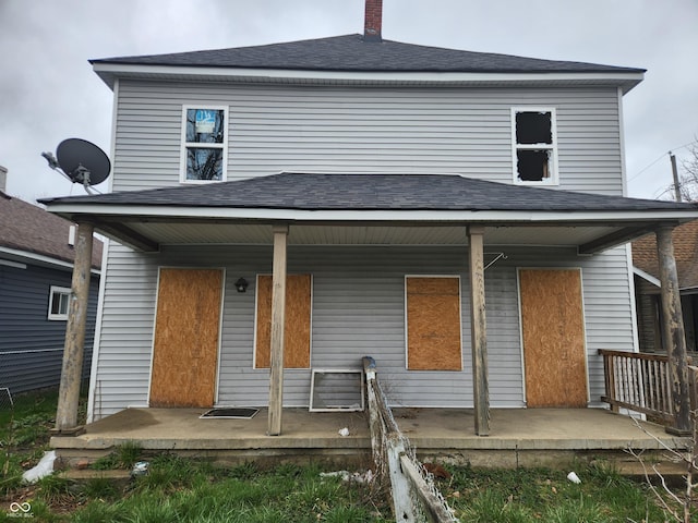 306-308 S Temple Ave, Indianapolis, IN 46201 - back of house with a porch, roof with shingles, and a chimney