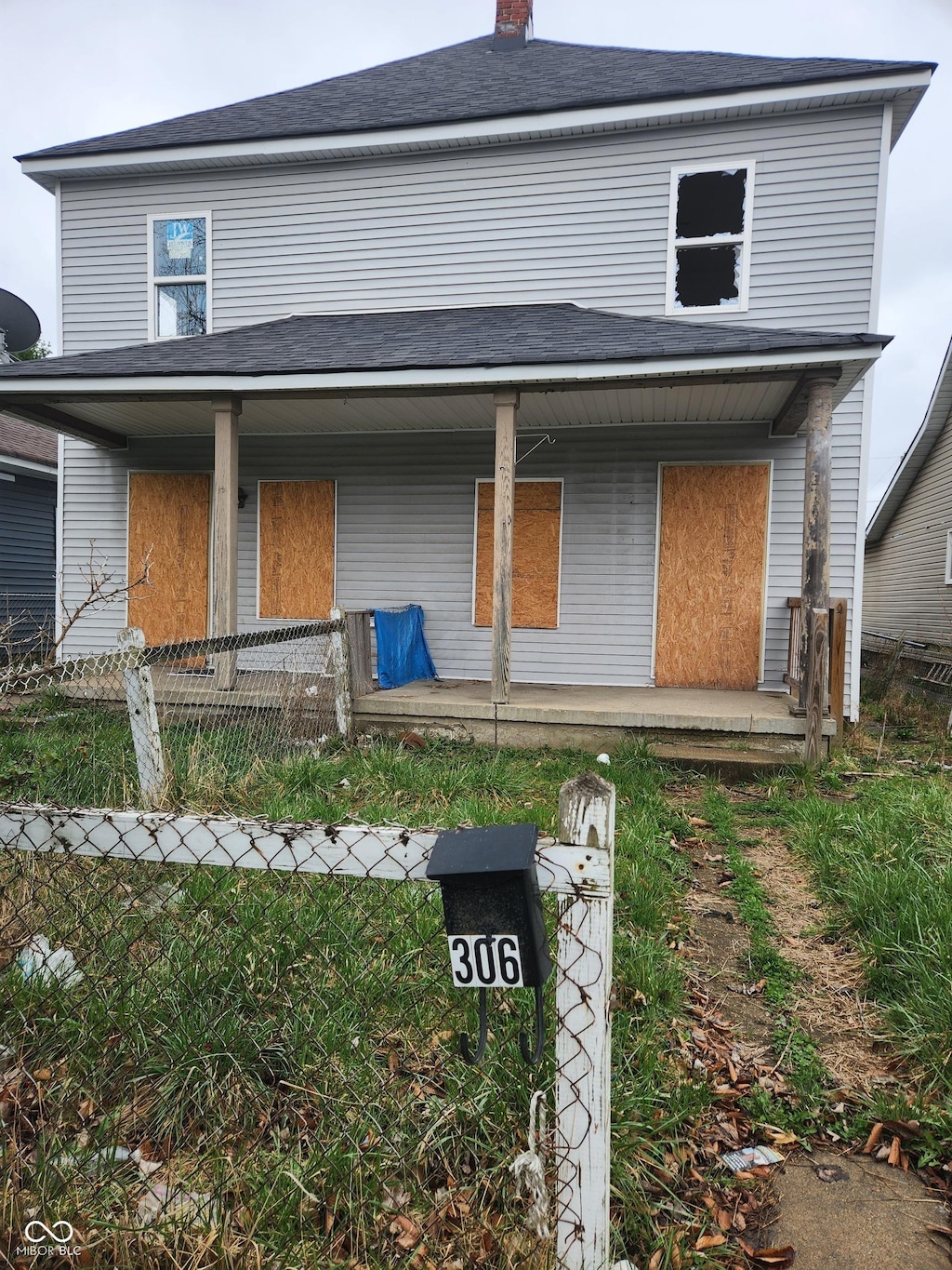 306-308 S Temple Ave, Indianapolis, IN 46201 - view of front of property featuring a porch, a chimney, and a shingled roof