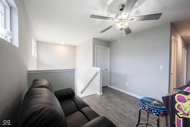 2628 Lamar Dr, Whitestown, IN 46075 - living area with wood finished floors, baseboards, and a ceiling fan