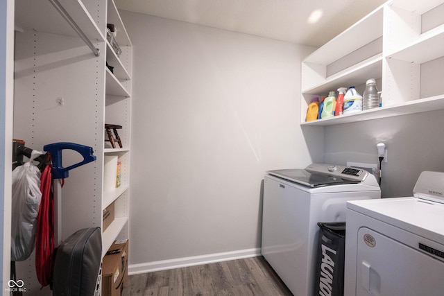 2628 Lamar Dr, Whitestown, IN 46075 - clothes washing area featuring separate washer and dryer, dark wood finished floors, and baseboards