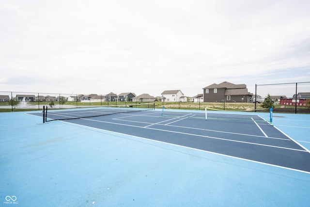 2628 Lamar Dr, Whitestown, IN 46075 - view of tennis court with fence and a residential view