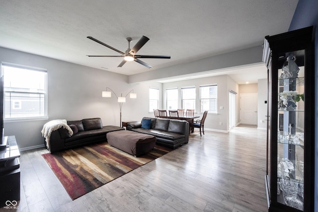 2628 Lamar Dr, Whitestown, IN 46075 - living room with a ceiling fan, baseboards, and wood finished floors