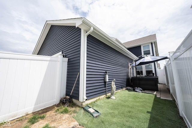 2628 Lamar Dr, Whitestown, IN 46075 - view of home's exterior featuring a hot tub and a lawn