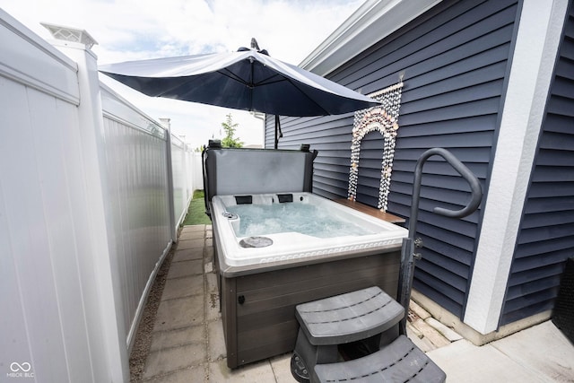 2628 Lamar Dr, Whitestown, IN 46075 - view of patio / terrace featuring a hot tub and fence
