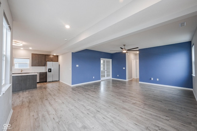 2628 Lamar Dr, Whitestown, IN 46075 - unfurnished living room with a ceiling fan and light wood-style floors