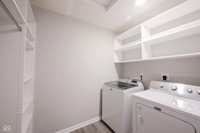 2628 Lamar Dr, Whitestown, IN 46075 - washroom with light wood finished floors and washing machine and clothes dryer