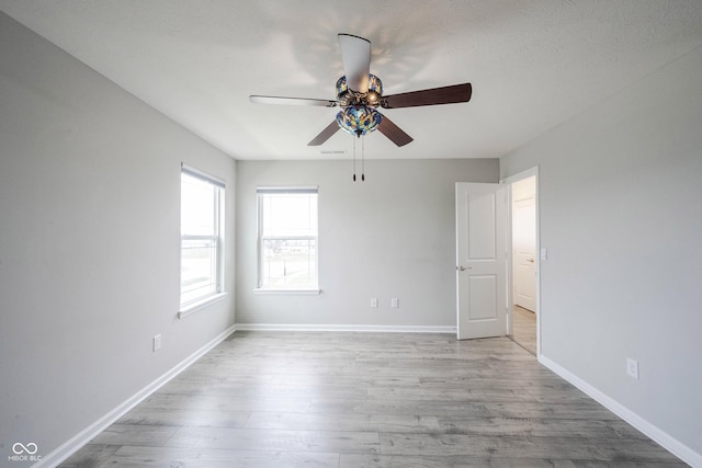 2628 Lamar Dr, Whitestown, IN 46075 - empty room featuring ceiling fan and wood finished floors