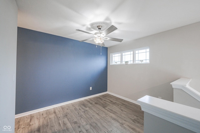 2628 Lamar Dr, Whitestown, IN 46075 - empty room featuring a ceiling fan and wood finished floors