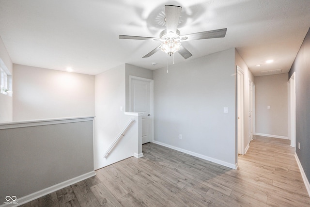 2628 Lamar Dr, Whitestown, IN 46075 - spare room featuring light wood-style floors, ceiling fan, and recessed lighting