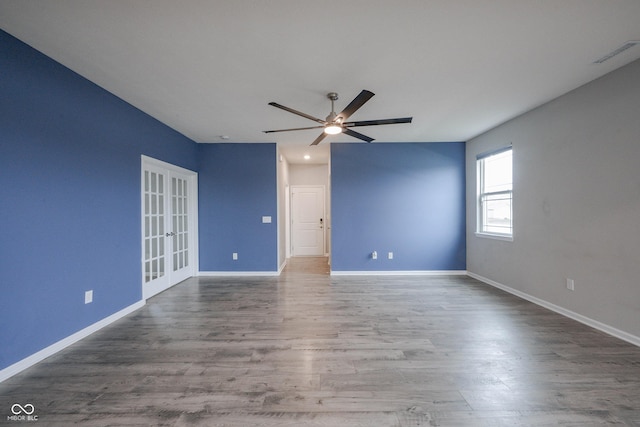 2628 Lamar Dr, Whitestown, IN 46075 - unfurnished room featuring a ceiling fan, wood finished floors, and french doors