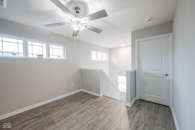 2628 Lamar Dr, Whitestown, IN 46075 - unfurnished room featuring wood finished floors, ceiling fan, and a smoke detector