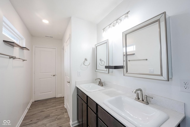 2628 Lamar Dr, Whitestown, IN 46075 - full bath featuring double vanity, wood finished floors, and recessed lighting
