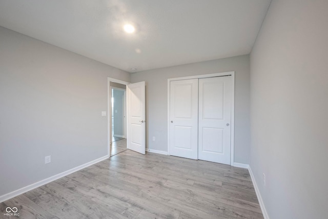 2628 Lamar Dr, Whitestown, IN 46075 - unfurnished bedroom with light wood finished floors and a closet