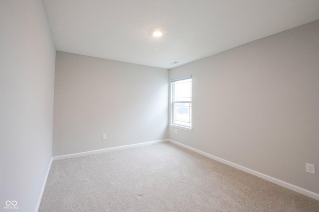 2628 Lamar Dr, Whitestown, IN 46075 - spare room featuring baseboards and light colored carpet
