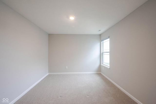 2628 Lamar Dr, Whitestown, IN 46075 - spare room featuring baseboards and light colored carpet