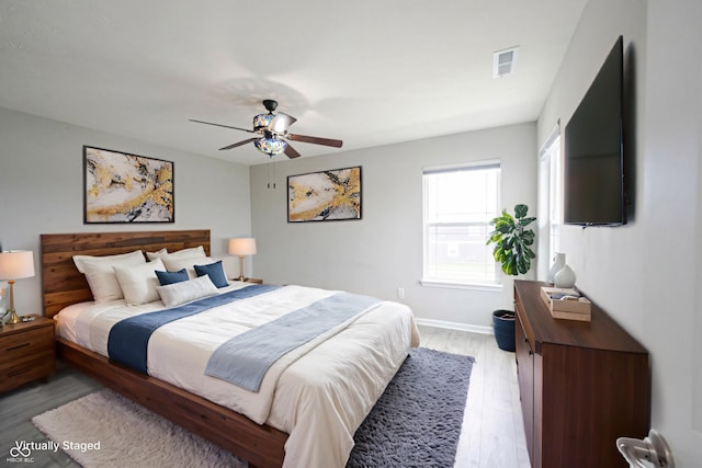 2628 Lamar Dr, Whitestown, IN 46075 - bedroom with light wood-style flooring and a ceiling fan